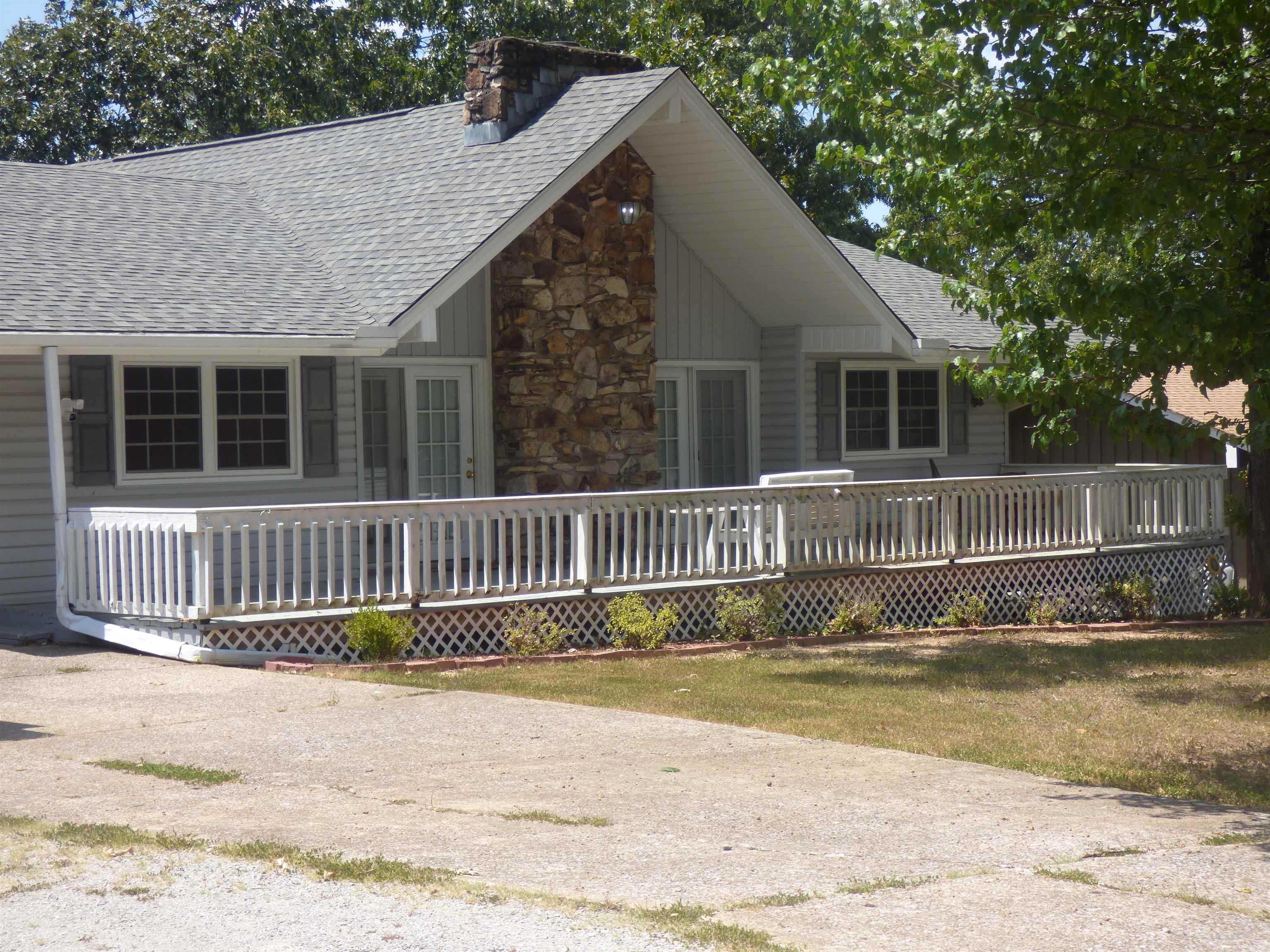 Beautiful 3 bedroom 1 3/4 bath home with vaulted ceilings and tons of natural light. Gas log fireplace and spacious split floor plan make this 1 level house perfect for family gatherings. Large deck on the front, and large back deck facing the wooded landscape makes a great space to grill out or enjoy your morning coffee. Large 3 car garage with shop area gives this one something extra! New roof in 2022, vinyl siding for easy exterior care and level driveway with plenty of space. Don't miss this one, call for your showing today! *Additional pictures will be available once the house has been cleared of furniture and decor*