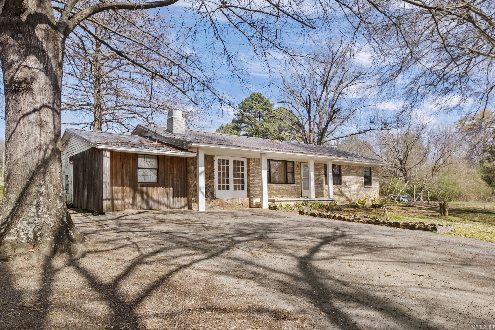 Older home sitting on 47.33 Ac with 14x20 shop and 12x16 Pole barn, and 2 ponds. This is beautiful land with ridge in the back. Plenty of building spots for a new home. 1582 is behind the house, power pole is still there. Call for more info. See confidential remarks