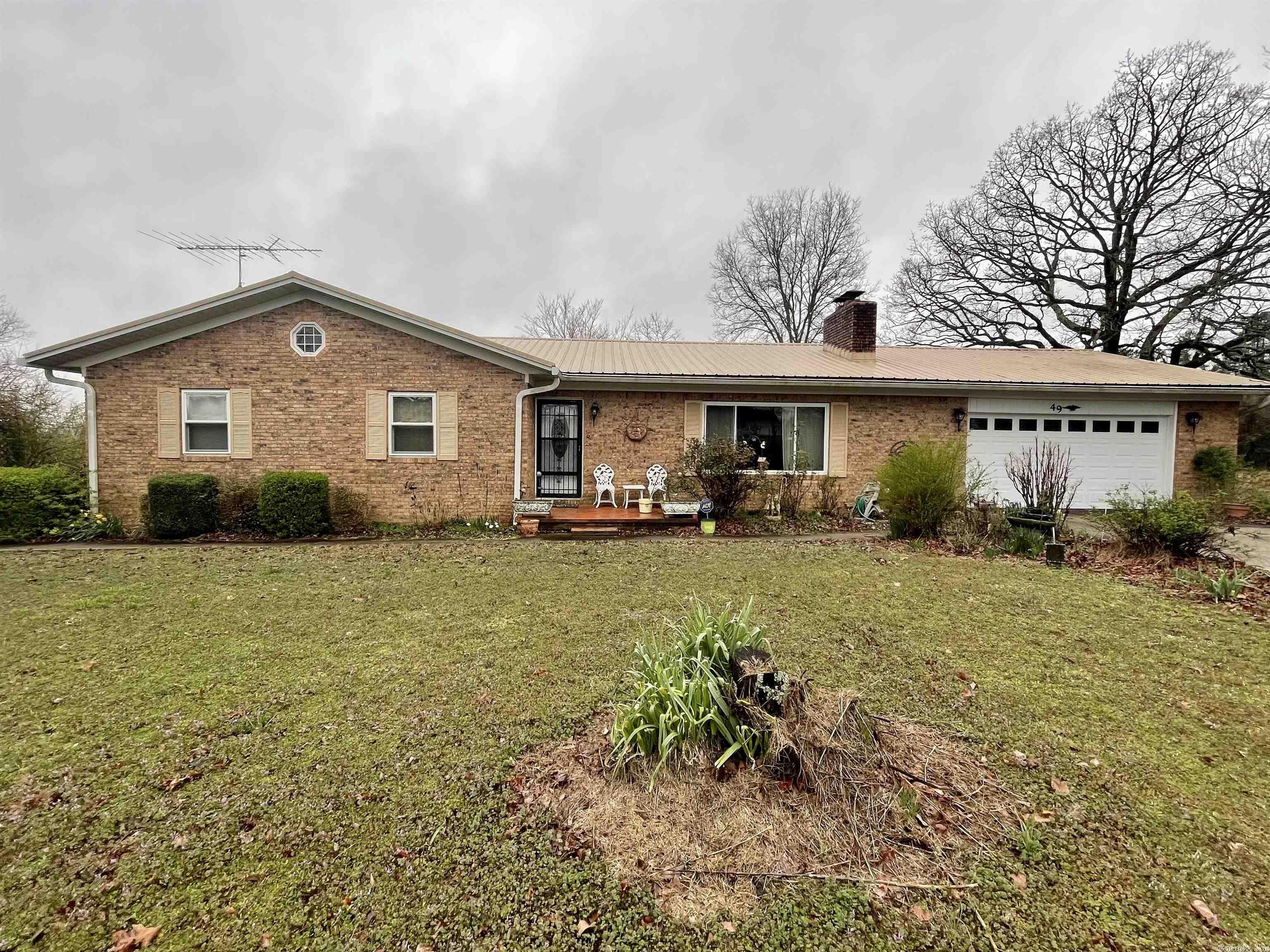 Looking for acreage in a rural setting with a serene creek and two ponds to enjoy? This property offers that and so much more! The amount of space this home has could easily fit a large family or use the finished walk out basement area as an in-law quarters or great entertainment space for guest & family. Features 2 kitchens, 2 living areas, 2 fireplaces, and additional rooms that could be used as bedrooms. Storage galore, Not only in the house but garage that features cabinets and a closet for all your storage needs. Several updates through out the years include 2 new HVA units, water heater, metal roof, windows, insulation, and so much more! You have approximately 10.75 acres to enjoy with a shop and shed that has sidewalk access to and from the house. Schedule your tour today!