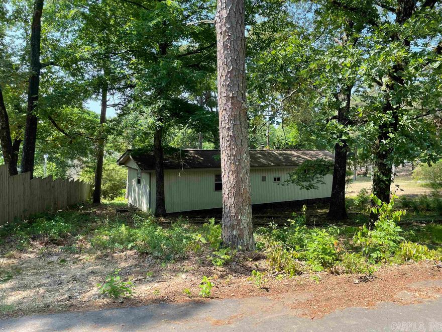 Come check this property out. Walking distance to lake access at the end of Whispering Springs Rd. where you can fish, swim, pull your boat up for an afternoon lunch break, etc. (not a boat launch here, but only 3 miles to Devil's Fork Park Boat ramp) 2 bed, 1 bath mobile with sunroom addition. Plenty of room to build a small garage for your lake toys!! Also, close to Janssen's restaurant.
