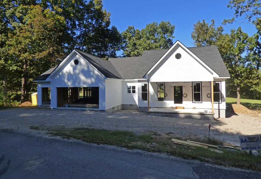 CUSTOM BUILT HOME ON THE SOUTH GOLF COURSE 2 LOTS This custom built home has 3 bedrooms, 2 baths, 1797 Sq ft, open living room, custom kitchen with cabinets and countertops built to suit, 9 foot ceilings, wood floors, dining room, and utility room.  The house sits on 2 flat lots with a 3 car garage, one door has rear access so you can drive your golf cart right out to the golf course.  Covered back porch with gorgeous views of #4 hole at the beautiful South Golf Course.  Cherokee Village offers owners seven lakes, two golf courses, recreation center, all surrounded by nature.  This home is still under construction so seller will build to suit.  You can have that dream home you always wanted with space and nice peaceful evenings.