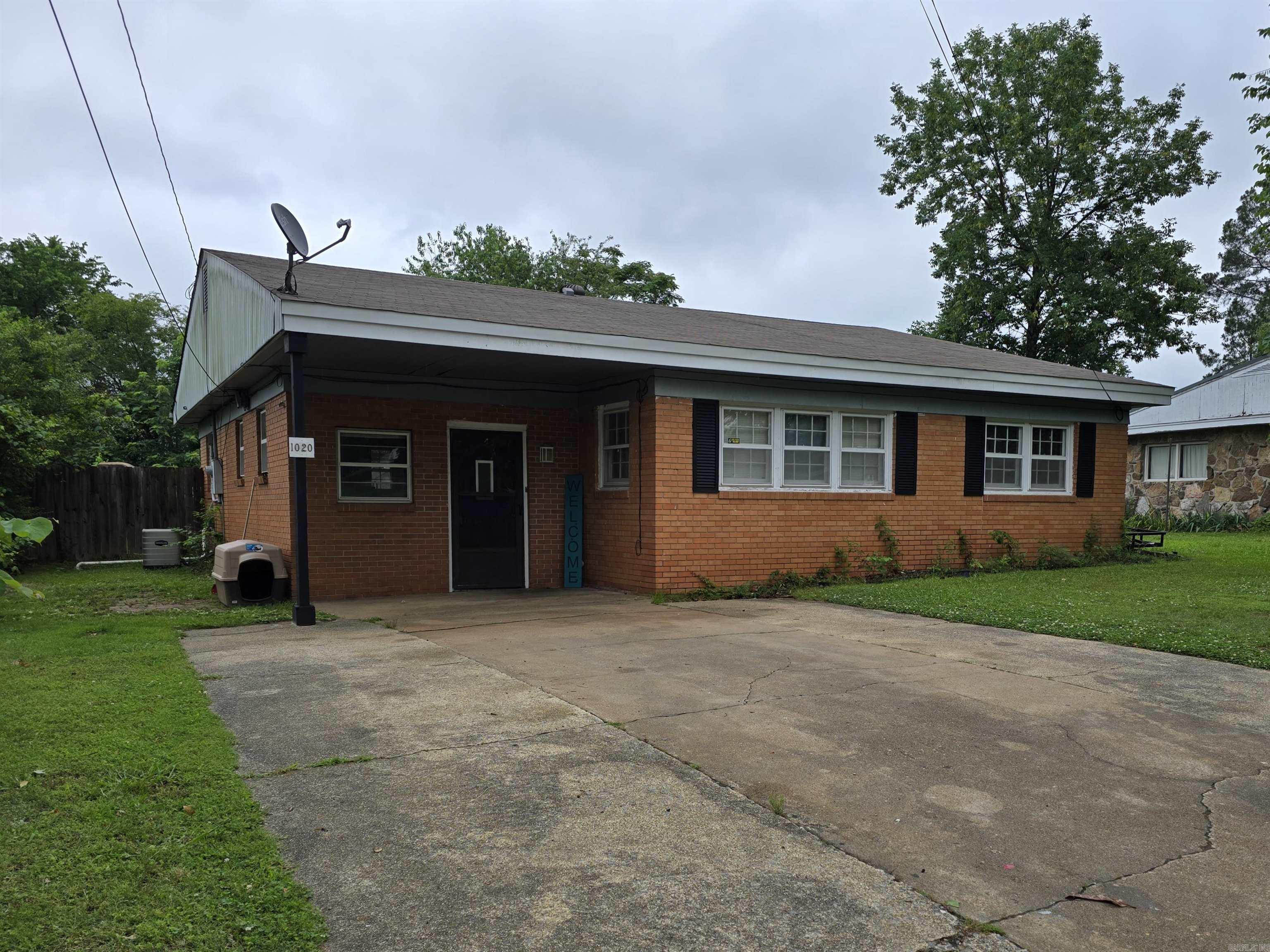 This is a 3 bedroom, 1 1/2 bath, Kitchen and dining combo, Bonus room, Separate laundry room. Single car carport, Large storage building inside a privacy fenced back yard.