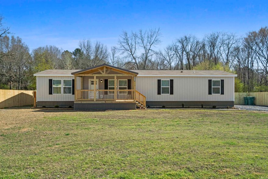 Country Living at its finest. New Construction 1904 sq. ft. manufactured home with permanent foundation and roomy front and rear covered decks on .69 acre. Open concept layout with split floor plan and plenty of room for a growing family. Great kitchen space with island and plenty of cabinet space. Everything on this property is brand new from the fences to the septic system. Exceptional en-suite primary bedroom with huge closet, walk-in shower, soaker tub, and dual Koehler vanities. Tons of space for the kids and fur babies to run and play. Home carries a 1 yr. manufacturer's warranty.