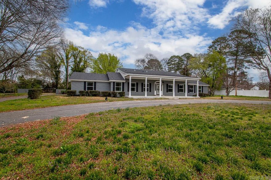 This property has undergone significant upgrades and renovations.  This home has great presence with a blend of modern amenities and comfort.  Features like Luxury vinyl, tile and carpet flooring, updated kitchen and appliances, sheetrock and painting throughout.   It has two comfortable and stylish living spaces with 2 fireplaces.  The game room off back adds more space for family and friends to visit and have fun.  Large lot is .92 of an acre.  Painted brick, new front concrete and renovated columns on the front porch.  Circle Drive in front.   6 bedrooms, 4 full baths and 2 half baths.  2 of the baths offer beautiful walkin, tiled custom showers.   Minutes from I-30 and 20 minutes to Beautiful Hot Springs National Park.  Square footage is estimated.