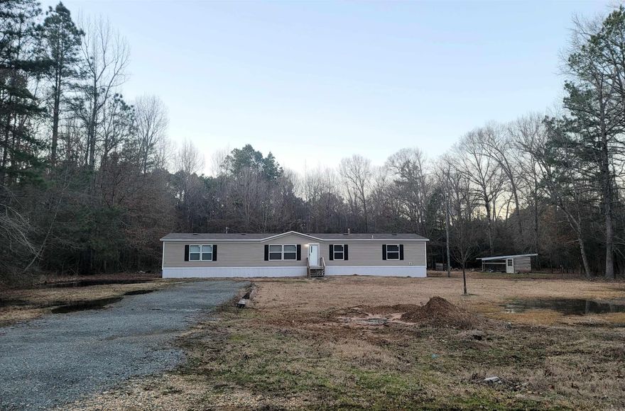 Room for all the kids! If you're looking for room to grow or just looking for each kid to have their own room, then look no more. This 2022 Vanderbilt doublewide is practically brand new sitting on 3 acres of privacy, and even includes a chicken coop! Home features all vinyl flooring, an Ecobee Smart Thermostat, and even comes with a fridge. You will love the split floor plan and the modern feel in this home. The MBD is HUGE with its own soaker tub and walk-in closet. The property is a foreclosure so make an bid! Seller will consider paying closing costs with an acceptable offer. This will go FHA for 3.5% down so don't miss this one! Call us today and let us help you get preapproved!