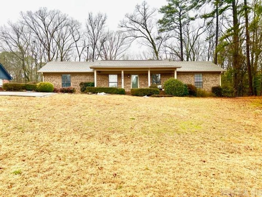 Welcome yourself home to this traditional brick home with inviting front porch.   This 3BR/2BA home has a lot to offer new owners, sought after neighborhood, desirable floor plan with split bedroom arrangement, built-ins, wood burning fireplace in living room, formal dining room, screened-in deck, 2 car-carport with storage on side, extra parking pad and shed with water and electrical to it.    Improvements: New Ceiling in Living Room & Kitchen 2020, New paint inside and out 2020, New Roof June 2021, New Water Tank October 2022, New Central Air Unit November 2015, electrical is hard wired for a generator.  This charming home is a must see!