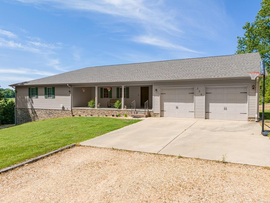 This beautiful custom-built home offers 4,920 square feet of living space and sits on 2 acres on a private dead-end road. The main level features approximately 2,460 square feet with four spacious bedrooms, each with walk-in closets, two large bathrooms, a generous kitchen and dining area, a convenient laundry room, and an oversized two-car garage. Step out onto the 12x30 deck or enjoy the peaceful views from the inviting front porch surrounded by nature. The fully finished basement, also 2,460 square feet, has its own entrance and electric meter, making it perfect for multi-generational living or rental potential. This level includes a full-size kitchen, living room, one bedroom with a large walk-in closet, a bonus room (could be 6th bedroom with no closet), a full bathroom, and a laundry hookup. There's also a large storage room and a one-car garage/shop with its own access. Additional features include a barn, some fresh paint, an 80-gallon Marathon water heater, and a new roof installed in 2023. With ample space, thoughtful layout, and versatile living options, this property is truly a rare find!