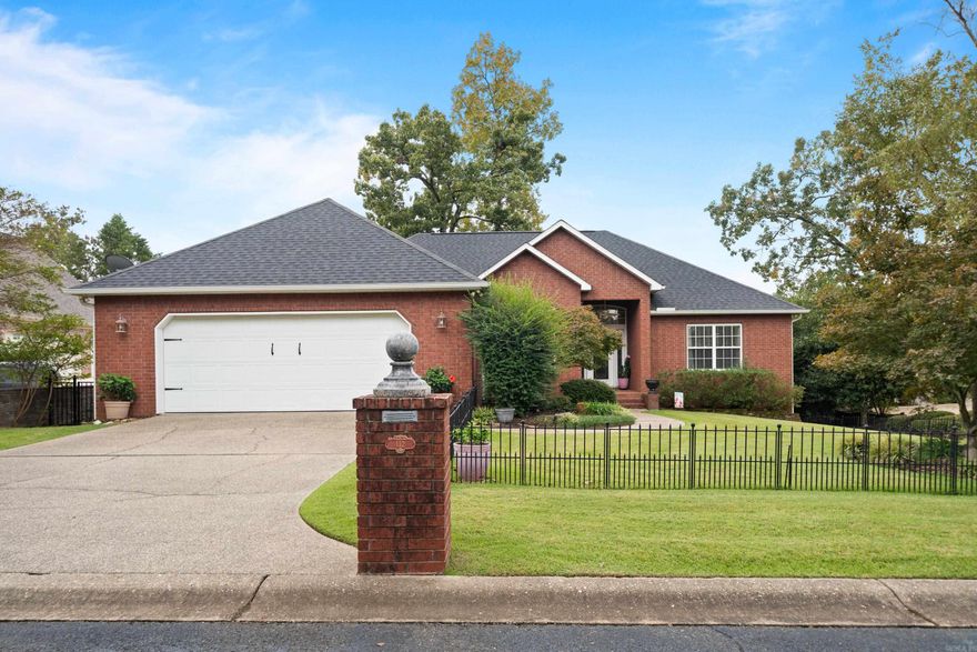 Pristinely maintained, this open and airy home features three spacious bedrooms, each with its own private bath, plus an additional half bath conveniently located off the living area. Custom built-ins and shutters provide a refined, elegant touch to this tastefully designed space. The entire back of the home opens onto a large deck overlooking a secluded, fenced backyard. Ample storage is available throughout, with even more space beneath the home for added convenience. Enjoy deeded lake access to beautiful Lake Hamilton, and the opportunity to purchase an additional lot directly across from the home.