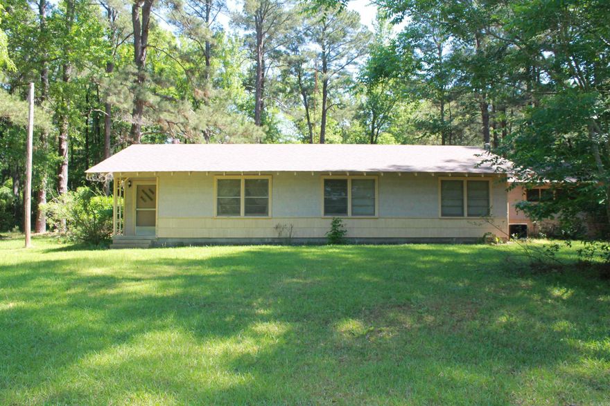 Country living just out of town situated on 6.54 Acres. HOUSE TO BE SOLD AS IS