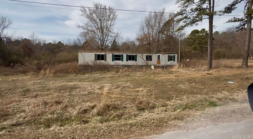 **Investment Opportunities**  Great opportunity for investors or buyers looking for rental income potential. These two parcels are being offered together and include one 1 acre tract with a single mobile home as well as one 3-acre tract with 3 existing manufactured homes each with separate septic, power poles, wells as well as registered separate mailing addresses for each. Utilities available for a fourth. Whether you are looking to renovate and rent, place new homes, or hold as income-producing property, this setup offers flexibility and upside. Priced with condition in mind and ready for someone willing to put in the effort. Solid opportunity to add to your rental portfolio.