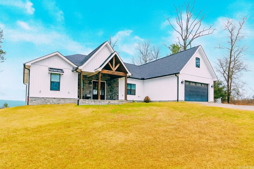 Welcome to this stunning 4-bedroom, 3.5-bath home offering 3,700 sq. ft. of open-concept living with breathtaking views of the Ouachita Mountains and high ceilings! The main level features three bedrooms plus an office or a fourth bedroom to suit your needs. A chef's dream kitchen with high end appliances and a gas range.  Upstairs, you’ll find an expansive 1,000 sq. ft. space complete with a full bathroom, providing endless possibilities. Build an additional bedroom or two, create the ultimate playroom, or design a game room and entertainment area-the potential is unmatched.  Situated on a dreamy piece of land with a year-round creek and huntable acreage, this property is a haven for nature lovers. Wildlife is abundant, offering a peaceful, private escape. Additionally, there is an extra shop pad with separate electric and sewer, giving you even more room to expand or build to fit your needs.  Whether you're looking for an exceptional short-term rental investment or a forever home surrounded by natural beauty, this property delivers it all.