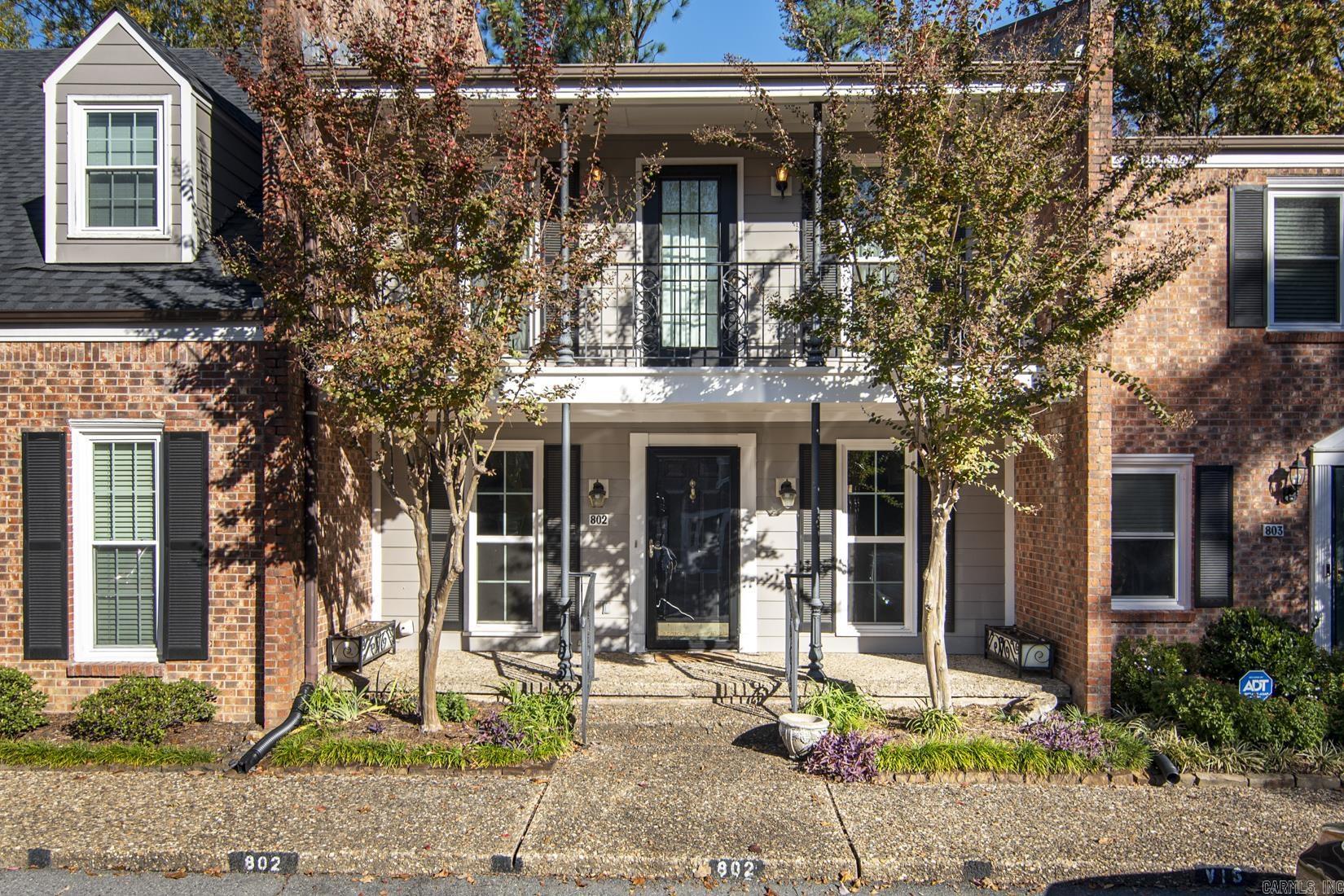 Welcome to this beautifully updated two-story condo that combines modern convenience with timeless charm. Featuring 2 bedrooms and 2.5 baths, this home is thoughtfully designed for comfort and style. The kitchen is a standout with marble countertops, a custom backsplash, custom cabinetry, and stainless steel appliances, perfect for culinary enthusiasts. The updated bathrooms include quartz countertops, sleek lighting, and modern plumbing fixtures, with the primary bath offering a luxurious walk-in shower. The living and dining area features new luxury vinyl flooring, built-in bookshelves, and a cozy gas fireplace, creating a warm and inviting space. Upstairs, you'll find two spacious bedrooms, both with en suite baths, including a balcony. Recent updates include a 2018 HVAC system, replaced windows, and plush carpet installed in 2019. Outside, enjoy the privacy of a fenced patio with a convenient storage room, ideal for entertaining or quiet evenings. This move-in-ready condo offers both comfort and convenience to restaurants, shopping and grocery stores.