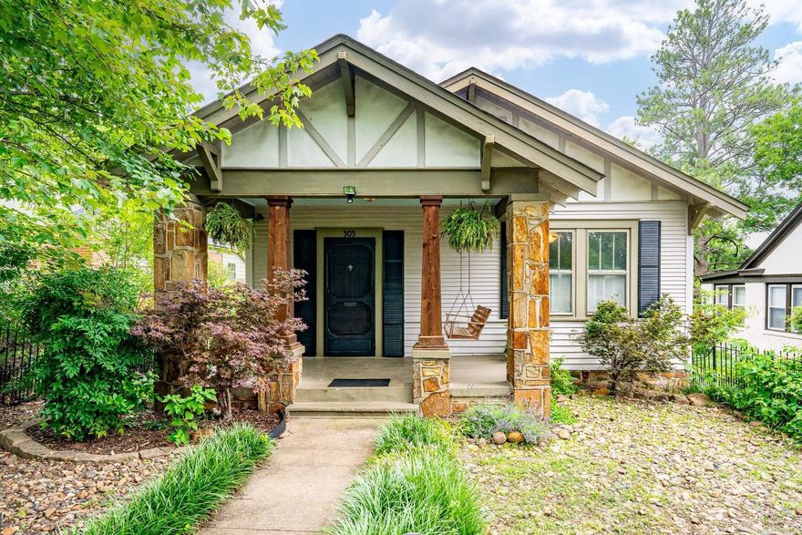 Wonderfully maintained artist’s Craftsman bungalow with beautifully landscaped lawn & garden spaces at the top of the historic Virginia Heights section of Capitol View. The welcoming front porch of this 3 bed/1 bath home boasts stained wood & rock design elements. The living area features a fireplace & lots of natural light opening into the large formal dining room. Original hardwood flooring. The kitchen has updates throughout including stainless steel appliances, new refrigerator, new flooring & large pantry. All of the bedrooms are a nice size and the hall bathroom has been completely updated. There is a separate laundry & storage area at the back of the house. The backyard is a wonderful retreat w/ beautiful tiered deck & hot tub that conveys. Two large outdoor storage buildings, exceptional landscaped yard w/herb garden & variety of flowering plants & trees. Directly across from the lawn of the Arkansas School for the Deaf w/views of the river & downtown Little Rock.