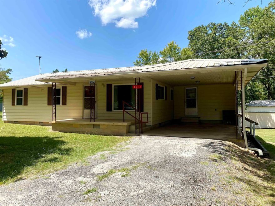 Cute investment property. 2 BR, 1 BA, large living area. Large laundry room which would have enough room for small office if needed. Sits on almost one acre. Home has a Generac generator.  There are 4 out buildings out back. One is very large. Two of the shops have electricity. Would be great for a business in one. There is also a well on the property.  HOME SOLD AS-IS.