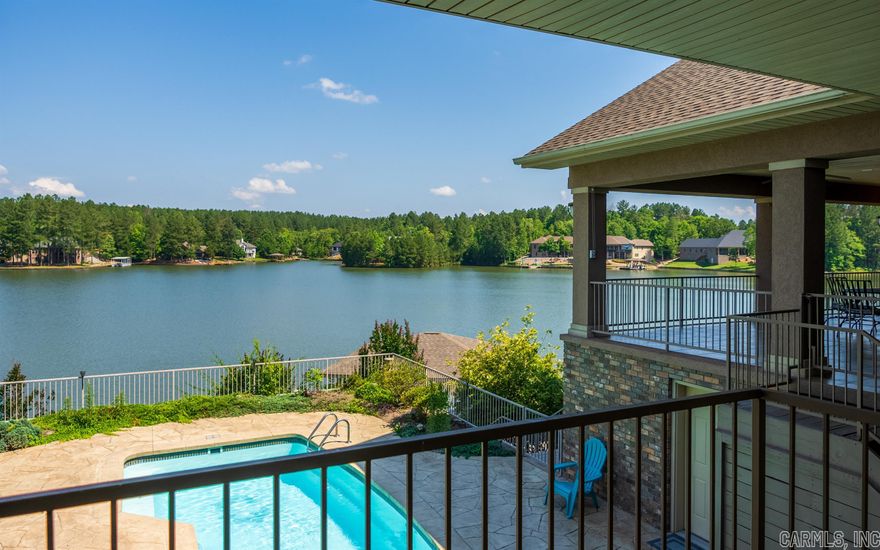 Lake Granada lake front home with arguably the best view on the lake.  Almost an acre lot lends it to a long driveway up to the home.  If you are not up for a boat ride, take a swim in the pool.  Your family and friends will definitely be coming for a visit.  Enjoy the expansive views from the large covered porch or inside through the large windows.  3 bedrooms and 2 baths upstairs and 1 bedroom, bath, living area and kitchenette in the lower level with outside access.  Live upstairs and rent the the lower suite as VRBO if desire.  3 car garage and boat dock for all your toys. AGENTS SEE REMARKS!