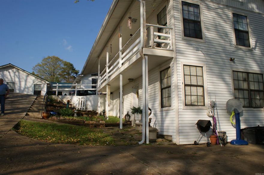 This 6,586 lakefront home on Lake Conway would make the prefect Event Center with pool and/or Air BnB. It has one of the best views of the lake. The main house is 5,218 sq. feet. Each apartment is 684 sq feet. (One bedroom one bath) the main house has 5 bedrooms 3 full baths and 2 half baths. 1.6 miles from I-40.  Enclosed front porch with a great view of the lake, formal dining room, kitchen with dining area, very large primary bedroom, game room with juke box, pool table, poker table, arcade games and bar to convey.  It has a dining room/game room that connect an doffer a large space for wedding, meeting and dinners. Pool can be entered separately formt he main house.  1 new HVAC unit in 2020. New stove 2020. New metal roof 2022. NO FLOOD INSURANCE REQUIRED!!! Priced at $66 sq. ft.