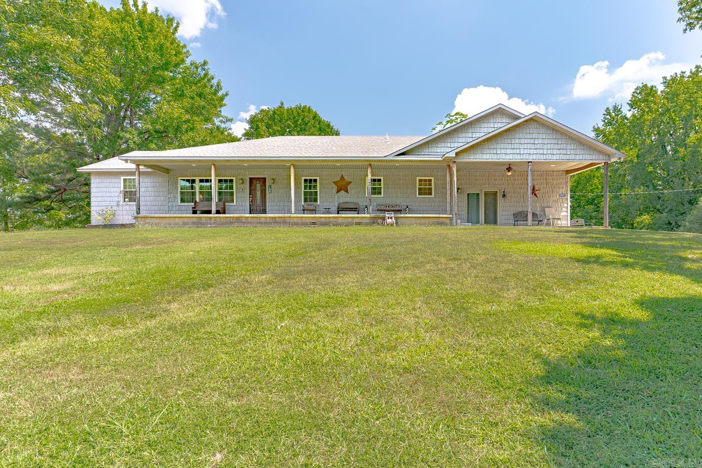 Welcome to this beautiful property sitting near the Greene County/Craighead County line. Situated on 1.96 acres of rolling hills, this house has had many updates in the last few years, including the addition of a beautifully tiled, wheelchair accessible shower. The roof and windows were updated 7 years ago. There are two spacious bedrooms, two bathrooms, and an additional room that could be used for an office or game room! The spacious den steps right out onto the front porch which spans across the front of the house. The three-car garage provides plenty of room to both store items and park. Don't miss the opportunity to enjoy the peaceful, serene countryside from your new front porch!