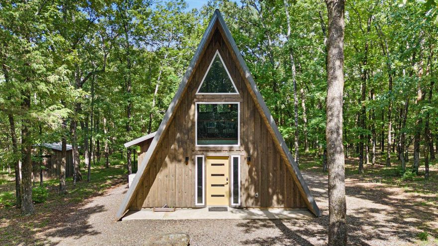 Thriving AirBNB business - Charming A-Frame Cabin Airbnb boarding Petit Jean Mt. State Park!! Dreaming of owning a profitable Airbnb? Locally known as the StAyFrame, this enchanting A-frame cabin, nestled by the highly traveled Petit Jean Mountain State Park is ideal for nature & outdoor enthusiasts. Only 3 years old & boasts almost 1,000 sq. ft. of glorified cabin living. Featuring**2 Cozy Bdrms including loft area w/serene treetop views & 1 full bath.**Modern & Efficient kitchen space, all appliances included.**Abundnce of natural light.**Private Natural Landscape, surrounded by private scenery for enjoying evenings outside on the patio for creating unforgettable memories.**Prime location & Turn-key opportunity with a fully furnished-Everything you need to welcome your first guests!