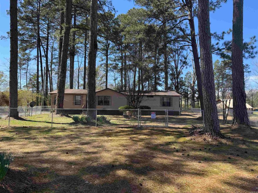 Well maintained home, on a nice lot in a beautiful country setting.  Three large bedrooms, 2 baths, large living and dining area as well as a hearth area with a gas fireplace off the kitchen.  There is a shop that is heated and cooled with a half bath, that was once a beauty shop.  There is another shop that is used for storing the lawn equipment that will stay as well.  Beautiful tall pine trees and a large yard make this country home a charmer. Call me today and lets take a tour!