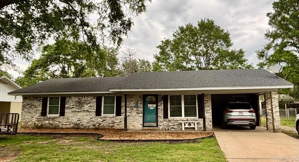 Spacious open floor plan with a large laundry room, 3 bedrooms, 1 full bath, 1 half bath, breakfast nook, and a covered patio, with a shop in back. This house was completely updated in 2022 with new windows, appliances, floor, paint, light fixtures and bathroom vanities. Closed in attached carport and added side parking has room for 4 cars.