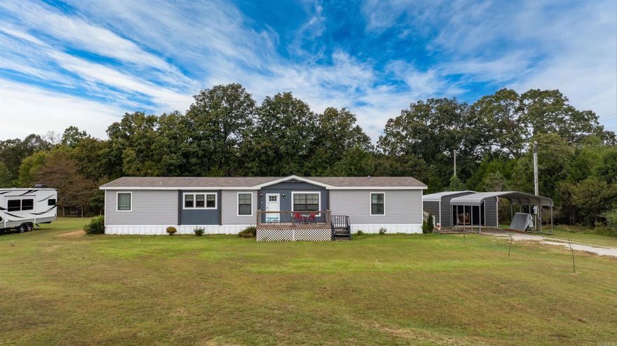 This property is perfect for those who value both modern comfort and a peaceful, scenic lifestyle. Built in 2020, this 4-bedroom, 2-bathroom home offers over 2,184 square feet of thoughtfully designed living space with two inviting living areas. The open dining, kitchen, and living space features beautiful flooring, upgraded fixtures, a large farm sink, and plenty of natural light, making it ideal for entertaining. The primary suite is a true retreat with a luxurious soaker tub and spacious layout, while the additional bedrooms and large laundry room ensure convenience for the whole family. Outside, enjoy the beauty of five stunning acres that back up to trees, offering room to roam, explore, and relax. A pole barn provides ample storage for farm equipment or outdoor toys, and the brand-new storm shelter in the shop adds peace of mind. Whether you’re unwinding on the porch, tending to your land, or gathering with friends and family, this home perfectly balances country charm and modern convenience. Don’t miss the chance to make this exceptional property yours—schedule your showing today!