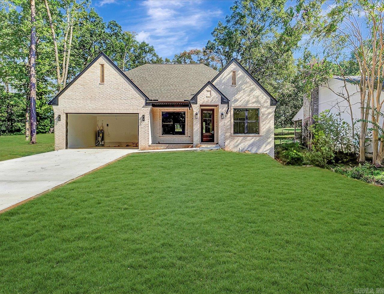 Diamondhead Golf Course Lot Newly Built Home! Enjoy this stunning new construction by Charles Anderson Homes! This residence boasts every luxury you could desire. The foyer opens up to a spacious Great Room with an inviting open floor plan and a stylish recessed electric fireplace. The kitchen and dining area showcase beautiful granite countertops, a range alcove with surround, and a large island that serves as additional dining space. Enjoy exquisite ceiling and cabinet fixtures throughout the home. The private Master Suite features double vanities, luxury vinyl flooring, a garden tub with upgraded tile surround, a custom tile shower, and two walk-in closets. On the opposite side, you'll find two bedrooms along with a guest bath and laundry room. Step outside to the covered porch, complete with an outdoor fireplace for cozy evenings. Plus, enjoy peace of mind with a One year Builder's Home Warranty! Estimate Completion Date within 30 days.