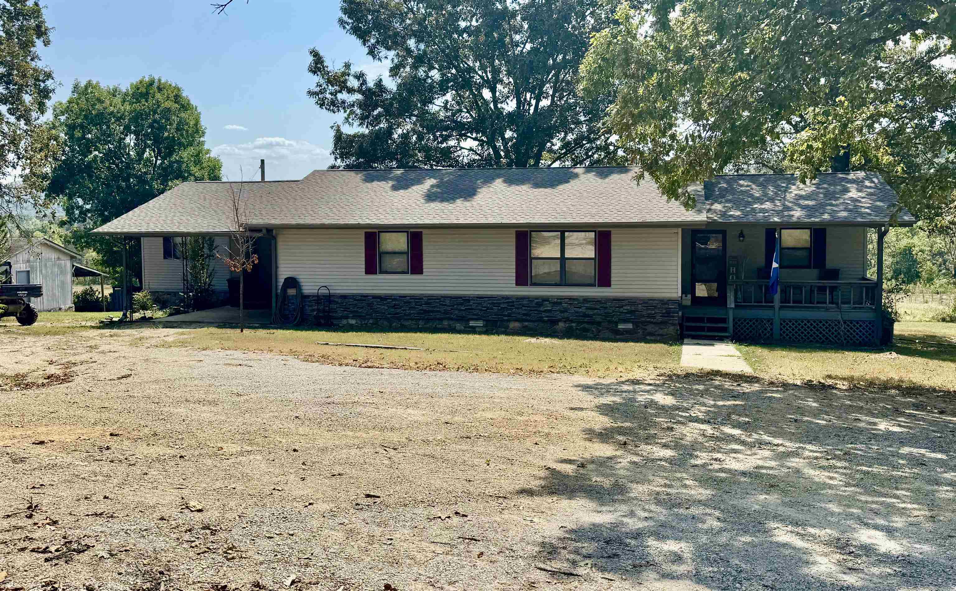 COUNTRY HOME on 7.5 ACRES WITH A VIEW! This 3 bedroom, 2 bath home has been recently remodeled! This home features a large living area, open kitchen/dining area, and a master suite with a walk in closet and full bathroom! Downstairs is a fantastic game room with a built in bar and kegerator that will convey! There is a 1 vehicle carport, large back deck, storage building, and a 12x32 workshop with electric ran! This property would be great for a Hobby Farm! New Roof installed in 2024! Located close to Piney Creek & the White River as well as Downtown Calico Rock! Additional 10 acres can be purchased