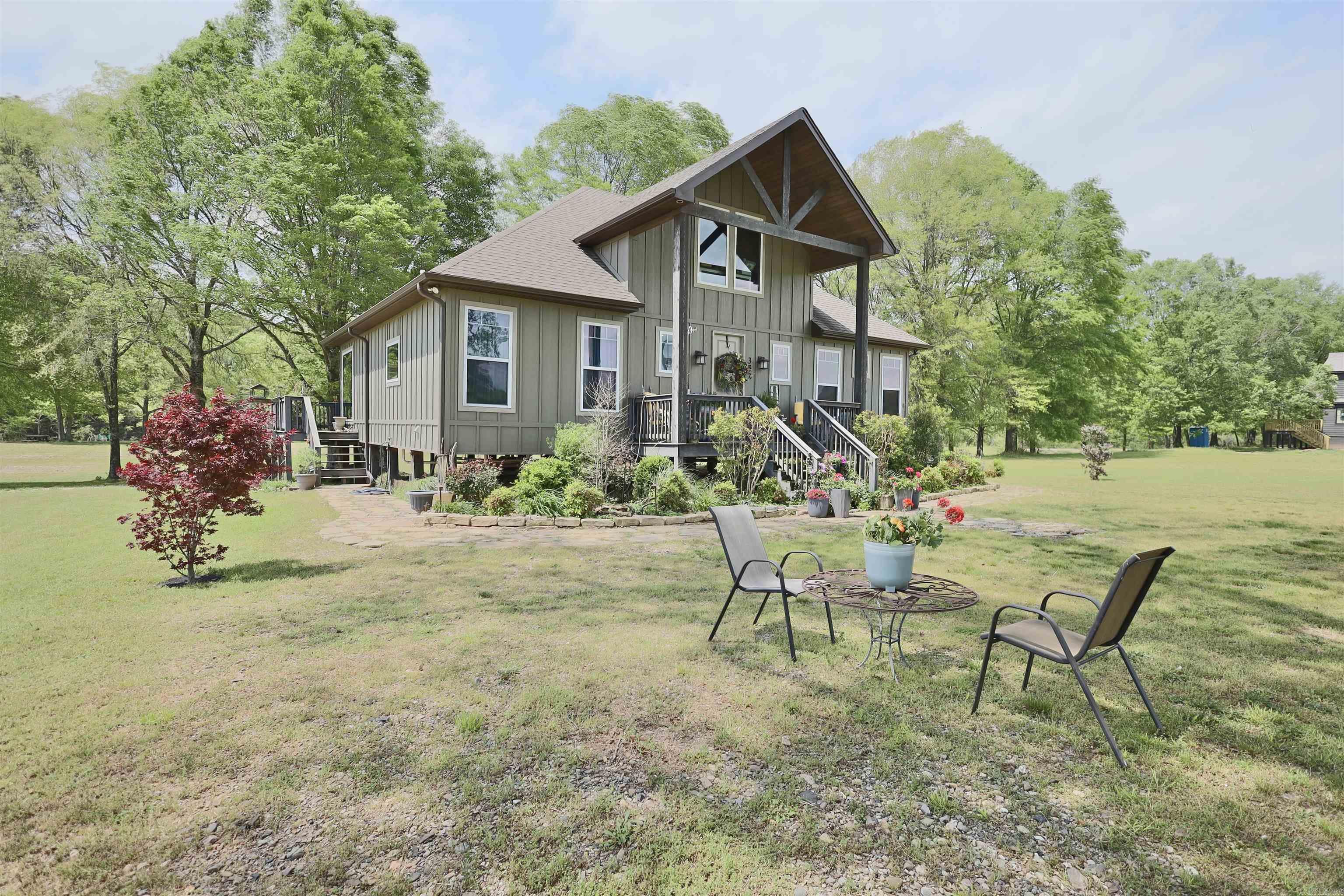 Tucked away in the secluded Rocky River Estates, this cozy cabin offers the perfect blend of privacy, tranquility, and natural beauty, with approximately 100 feet of private gravel bar frontage on the Caddo River. Adventure and relaxation await just outside your back door. Whether youāre looking for a weekend getaway, a company retreat, or a full-time home, this cabin delivers a unique lifestyle thatās hard to find. Inside, the cabin features an open floor plan, a massive rock fireplace, large picture windows, and a lofted living space, providing comfort, warmth, and breathtaking views from every room. The craftsmanship is exceptional, with thoughtful details you truly have to see to appreciate. Surrounded by river and mountain views in every direction, this property is located in the foothills of the Ouachita Mountainsājust five minutes from Glenwood, 10 minutes from the Glenwood Country Club and Golf Course, and only 45 minutes from Hot Springs. Youāre also within reach of numerous lakes, rivers, and outdoor recreation. Donāt miss your chance to own a slice of paradise on the Caddo River.