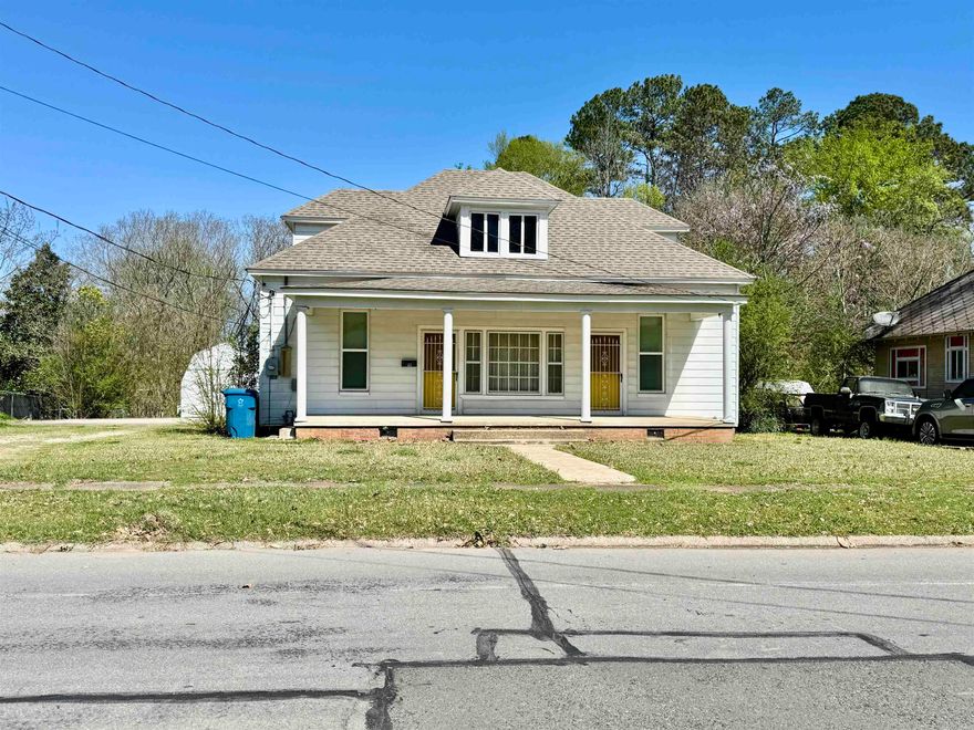 Beauty of old awaits you.  This Bungalow cottage has so much potential.  High ceilings, wide door ways with open living/dining areas.  2 full bathes.  House has been used for duplex at one point in it's life.  Washer/dryer and refrigerator does convey 2019 HVAC system installed also roof recently replaced. Storage upstairs could easily be transformed into living space.    Concrete pad for parking. Large lot with plenty of room in back yard for large garden.  Property offers a 12 x 20 utility shed and storm cellar.  Front and back porch to enjoy sitting on nice afternoons and enjoying the breeze of the day.   Priced to sell.  Make your appointment today.   Agents see showing remarks