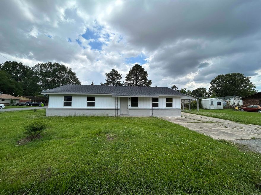 BACK ON MARKET! No fault of seller or home! Welcome to this stunning newly remodeled home that perfectly blends modern upgrades with timeless charm. Step inside to find brand new flooring throughout and fresh interior paint that brightens every room. The heart of the home features a spacious living area, a separate dining room ideal for entertaining, and a gorgeous tiled walk-in shower in the updated bathroom—a true spa-like retreat.  Every detail has been thoughtfully upgraded, including all new energy-efficient windows, stylish new light fixtures, and a brand new roof for worry-free living. The bedrooms offer generous space and feature roomy closets for all your storage needs.  Outside, enjoy a covered concrete slab patio that’s perfect for grilling, relaxing, or hosting gatherings with friends and family. This home is move-in ready and designed for comfort, style, and functionality—don’t miss your chance to make it yours!