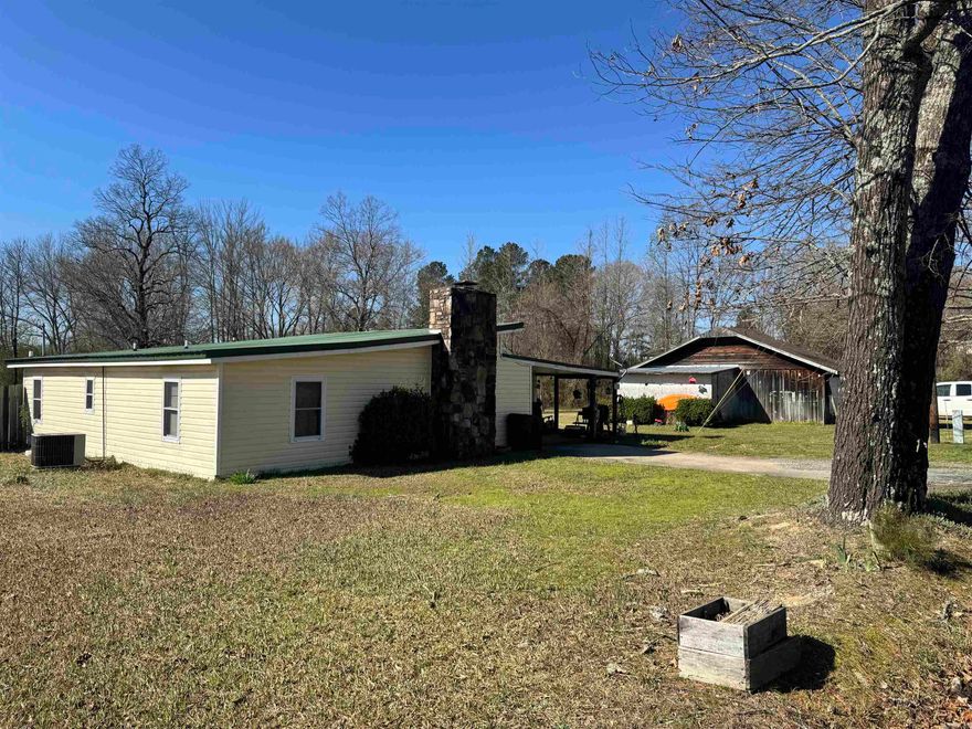 Located within city limits, this 1.03-acre property on Westmoreland offers a rare combination of space, character, and convenience. The three-bedroom, two-bath home features a spacious living room highlighted by a large rock wall and a fully functional fireplace that serves as a striking focal point. The home is equipped with electric appliances and is already plumbed for gas, requiring only the installation of a gas meter for future use. Outside, a small creek runs through the property, adding a natural element that is uncommon for an in-town setting. The land backs up to Highway 375 while still providing usable acreage. A detached shop with a garage door offers flexible space for storage, equipment, or projects. With its generous lot size, city location, and unique features, this property presents an excellent opportunity for those looking for room to spread out while remaining close to schools, shopping, services, and everyday conveniences.