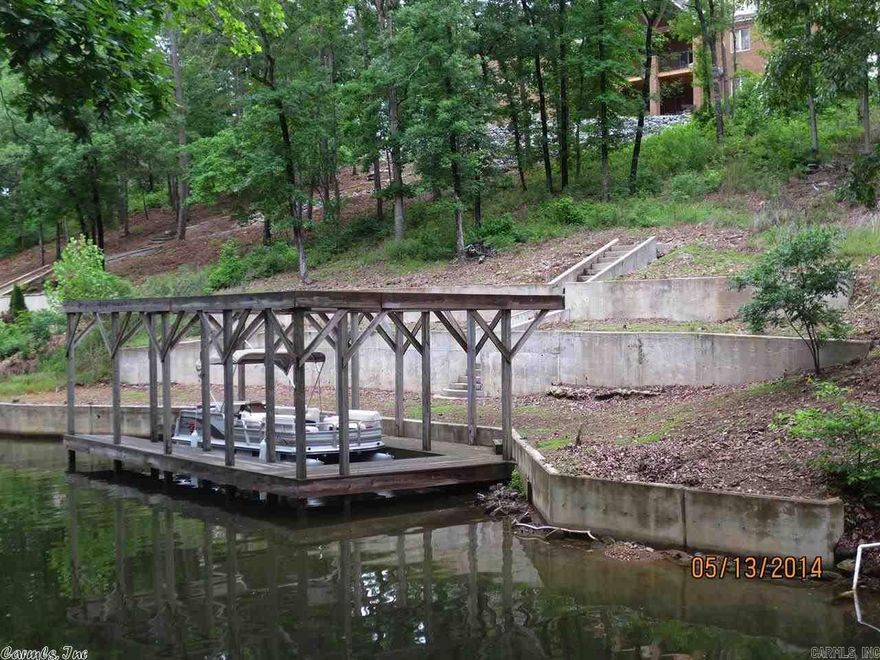 110 FEET LAKE HAMILTON FRONTAGE WITH BOAT DOCK & SEA WALL- READY LOT TO BUILD WITH MOST UTILITIES AVAILABLE--3000 SQUARE FOOT MINIMUM STICK BUILT HOME--LAKESIDE SCHOOL DISTRICT-- COME BUILD YOUR DREAM HOME--