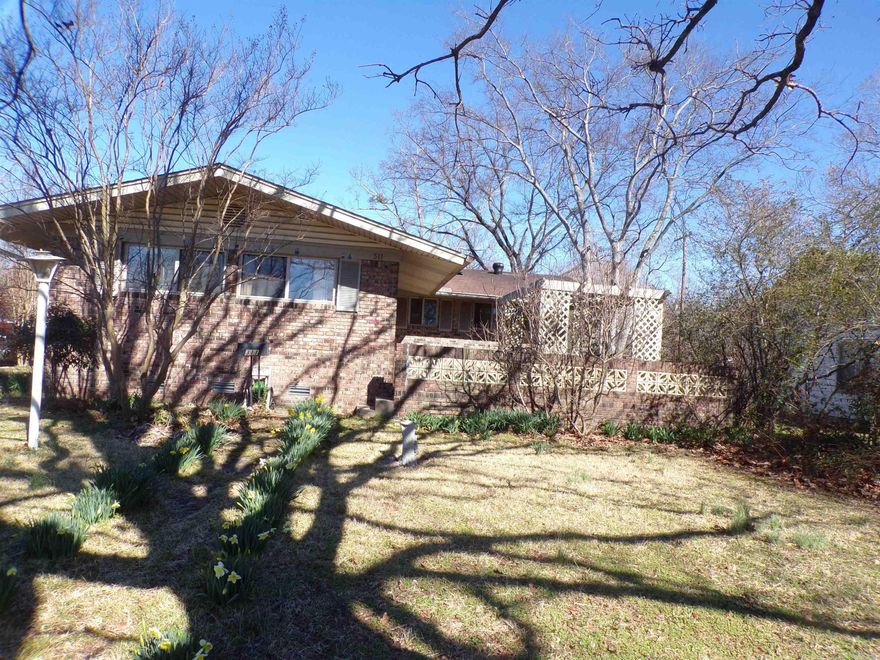 Don't miss this 3BR, 1.5AB on over-sized fenced corner lot. Original hardwood floors. Home features two sided gas fireplace opens into living area and eat-in kitchen. Laundry room w/washer & dryer. Bonus room off kitchen for study, office, game room w/extra window cooling. 2 car garage side loading. Recent updates include: Seal Solar panels - 2019, heat & air 2021, new sewer line-2020, dishwasher - 2021, stove top - 2022. Square feet is estimated, please measure. November NLR Electric bill was $12.81!!