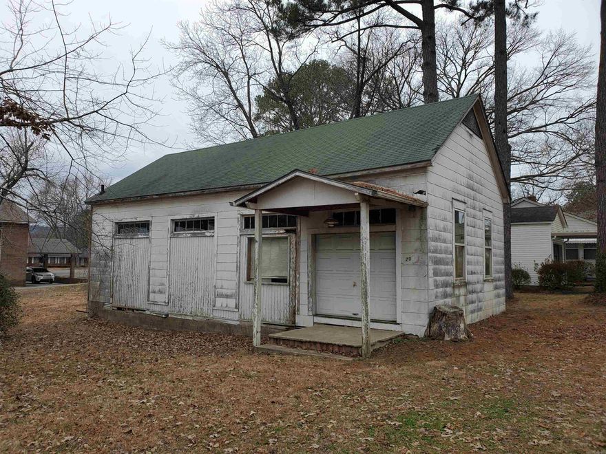 County records show this building to be 50 years old but it looks like 1920's to 1950's construction. Currently used for storage and is in need of some repairs.  No utilities are currently in use but has had them in the past. Nice level area for parking if needed.  Priced to sell and will make an excellent shop, storage building or business. Zoned C1. Come check out this incredible value!!
