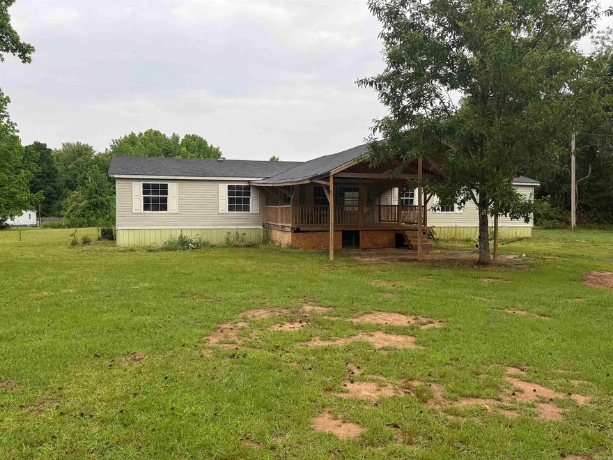 Large double wide sitting on 3 acres conveniently located between Conway and Greenbrier. This home offers 4 bedrooms and 2 bathrooms, 2 living room areas, electric fireplace and a new roof placed in 2022. The home is in normal working order but is priced to sell-as-is.