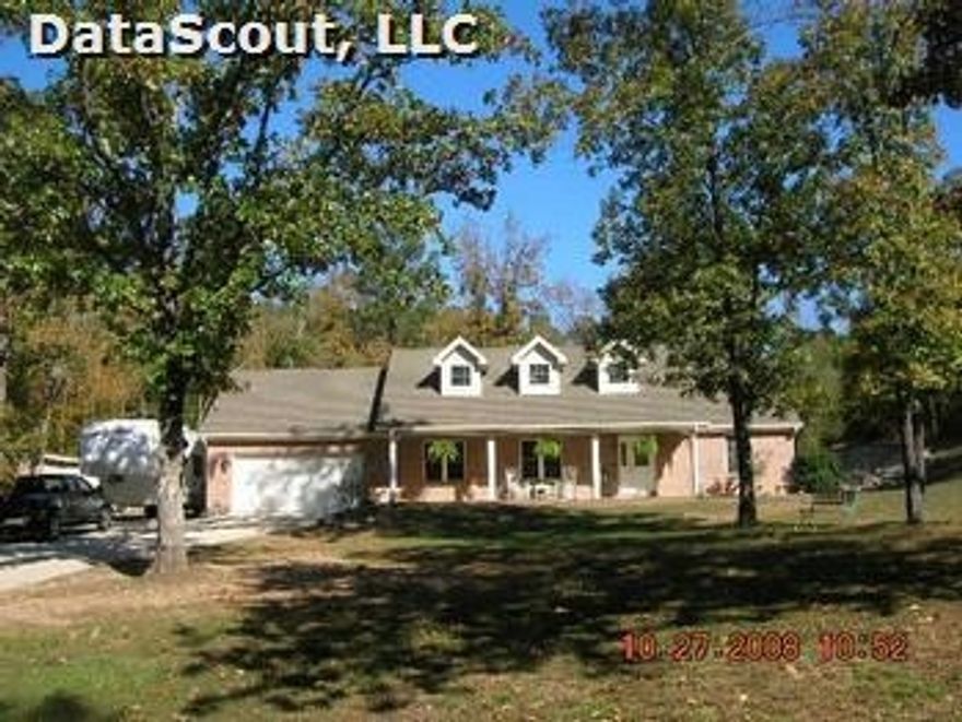 Split plan with 3 bedrooms, 2 baths and 2 car garage.  Separate storage building next to home.