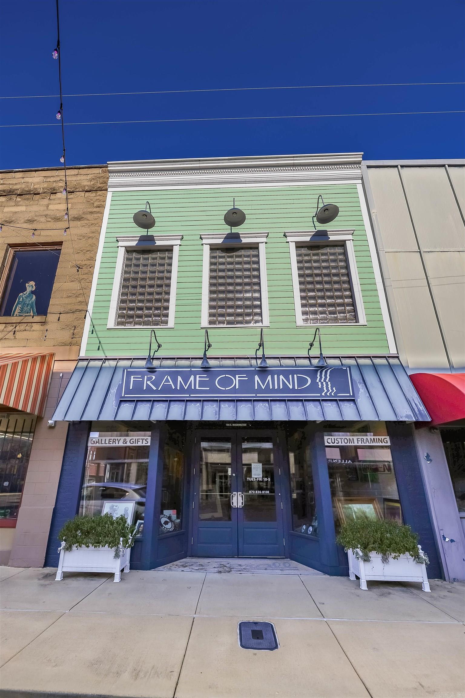 Imagine living in the heart of downtown! With the unique option of over 2,400 sq feet of upper studio living, this historic storefront offers fresh and modern curb appeal with many key updates. Zoning allows upper-story living space for the ideal housing hack -- commercial space on the ground floor to maximize traffic, and livable or rentable housing above! The open and airy front retail space is perfect for that inviting feel with room in the back with private workspace, office, kitchenette, bathroom, plus access to the additional levels. The versatile upstairs is enhanced with hardwood floors and natural light facing Washington St. If you need more storage, check out the basement with an additional partition and solid slab foundation. While this unique building is a blank canvas for your vision, there's an opportunity to purchase the inventory and established clientele for framing services. More details provided upon request.