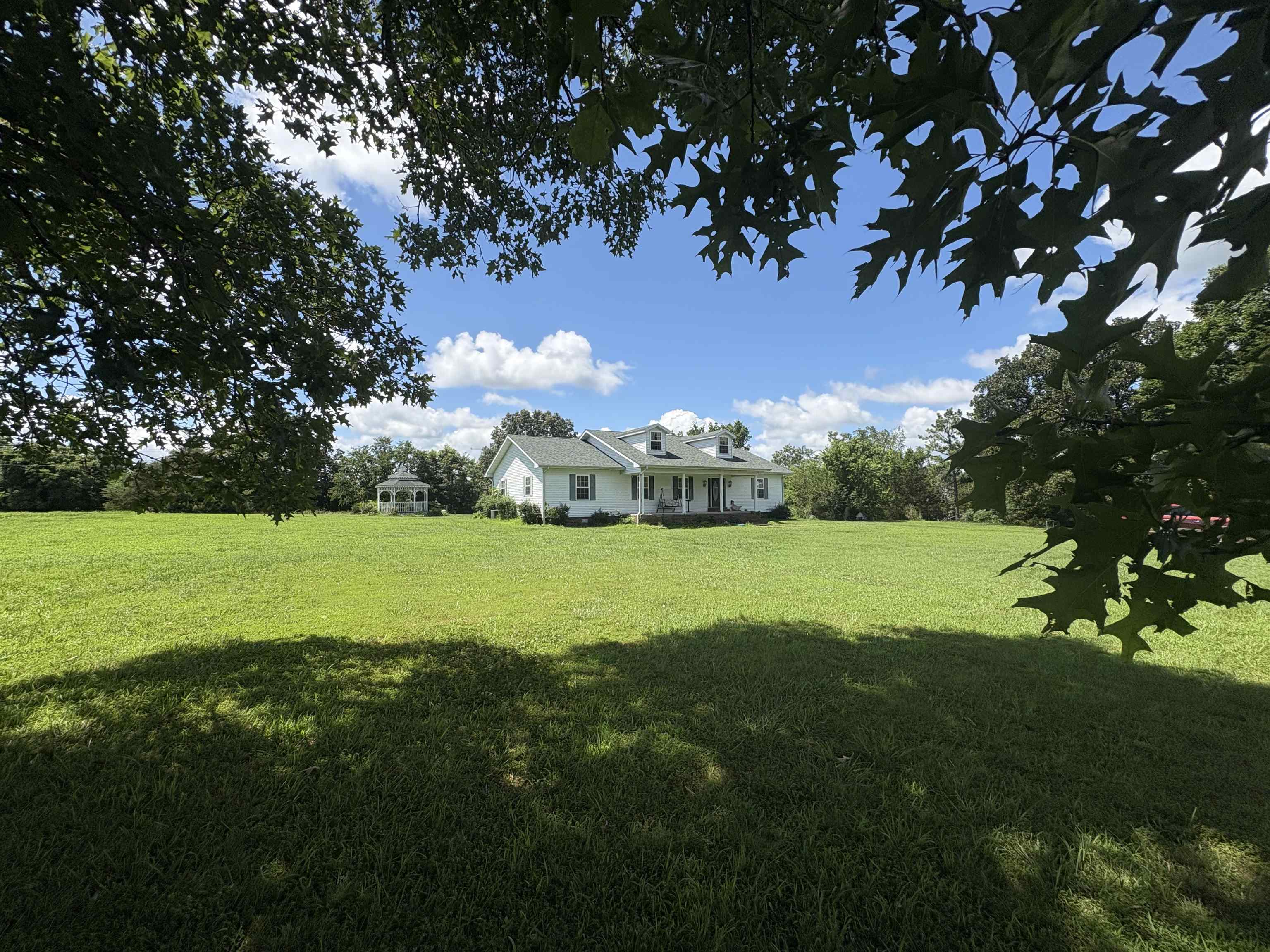 Experience peaceful country living on this beautifully maintained 2-acre+/- property along Hwy 354. This 3-bed, 2-bath home offers nearly 2,000 sq ft with wide hallways, large door frames, and full handicap accessibility, perfect for retirement or anyone seeking comfort and ease. Cozy up by the gas fireplace, park under the spacious covered carport, and enjoy the 960sqft garage heated, cooled, and complete with a fully floored attic. A storm shelter adds peace of mind. Just a short drive to Horseshoe Bend and the Box Hound Marina beach on Crown Lake, youāll have easy access to boating, fishing, swimming, and lakefront relaxation. This is more than a home, itās a country lifestyle designed for freedom, function, and charm!