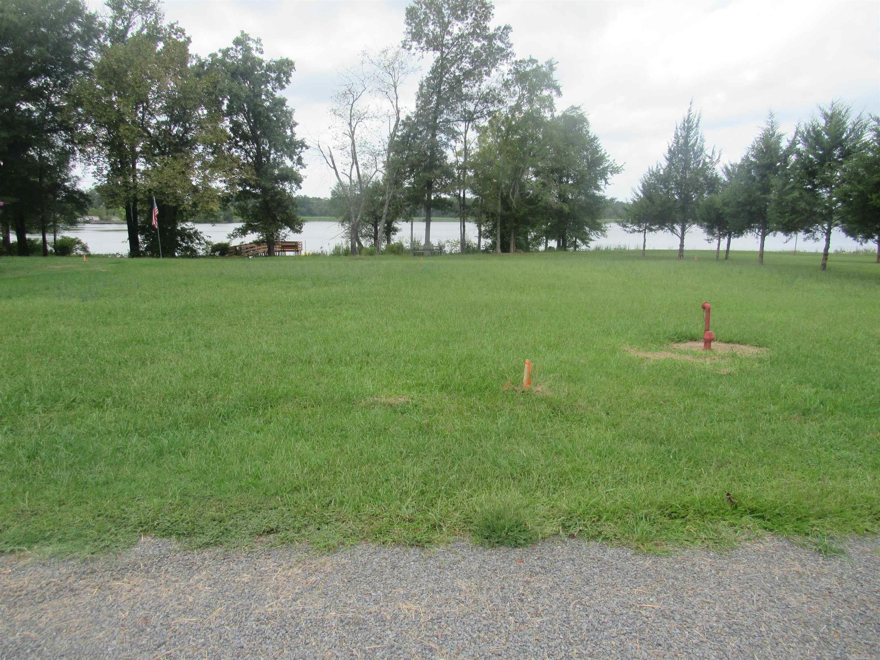 A rare find on Overcup Lake! 2 Adjoining lake front lots ready for development. Gentle walk down to the lake. New survey in documents. There is no dock at shoreline and buyer would need to ask for a permit to build one. 2020 regulations for properties on Arkansas Game and Fish properties are also attached. Game and Fish officer said that structure must be at least 50 feet from the water line. Septic tank installer said due to the size of the lot he could only approve about 1000 sf home for new septic tank. Perc test is buyer's cost. County water and electricity at the road. ## SEE AGENT REMARKS ##