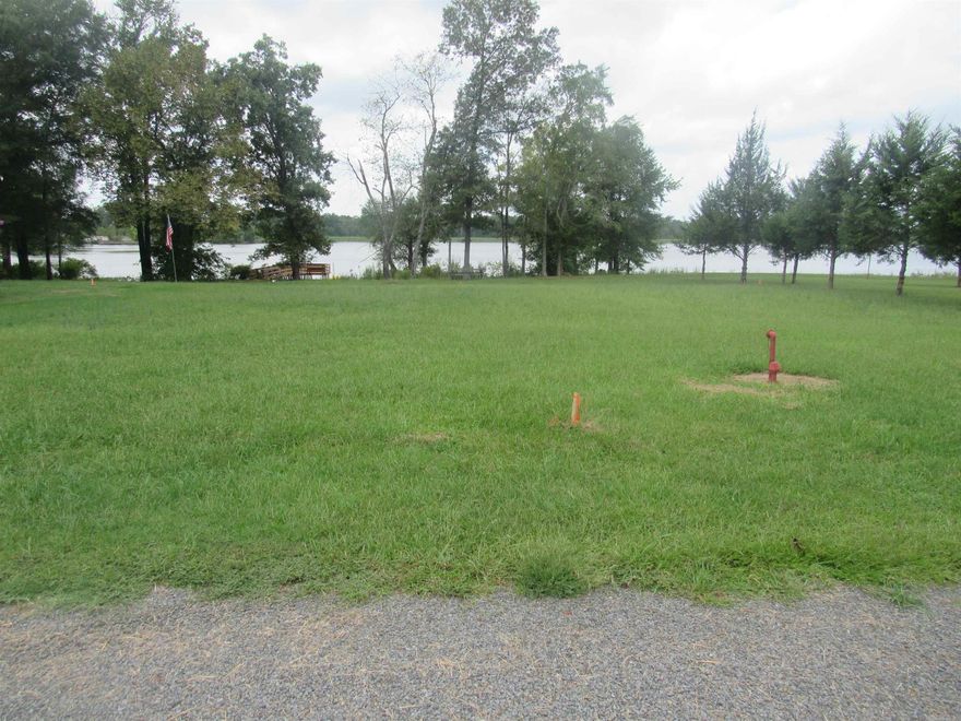 A rare find on Overcup Lake!  2 Adjoining lake front lots ready for development.  Gentle walk down to the lake.  New survey in documents.  There is no dock at shoreline and buyer would need to ask for a permit to build one.  2020 regulations for properties on Arkansas Game and Fish properties are also attached.  Game and Fish officer said that structure must be at least 50 feet from the water line.  Septic tank installer said he could approve up to 1000 sf home with traditional field line septic system. Perc test is buyer's cost.  County water and electricity at the road.  ## SEE AGENT REMARKS ##