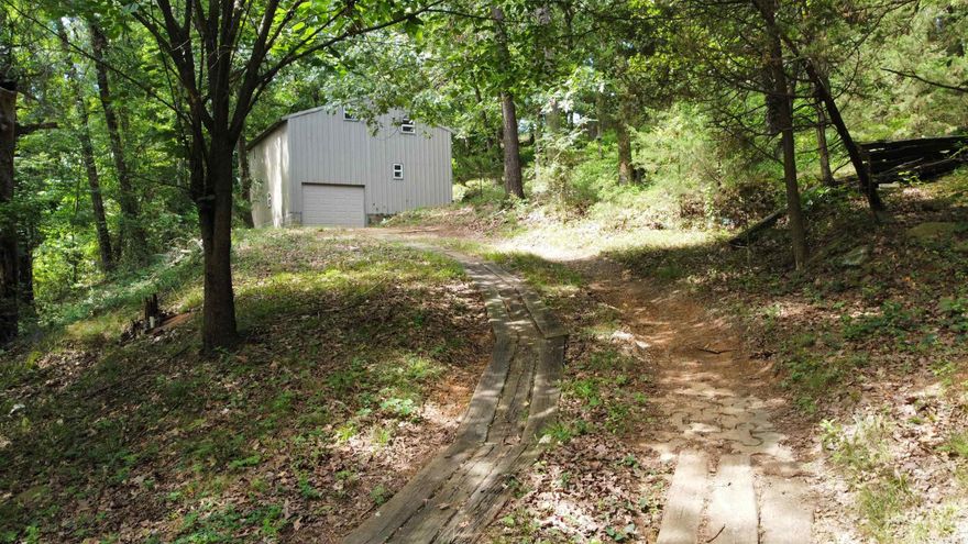 Beautiful 2-acre property featuring a 24x24 shop with a bathroom. Enjoy seasonal views of the river valley from this peaceful setting, the perfect spot to build your dream home or place a modular home.