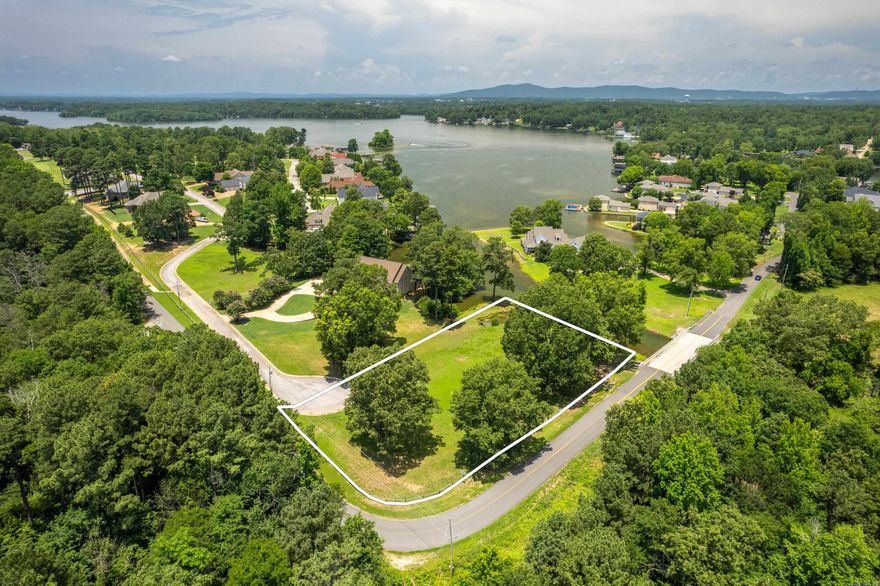 Ideal for Your Custom Build! Located in the desirable Oak Shores subdivision within the Lakeside School District, this level lot offers an excellent opportunity to build a home that fits your lifestyle. With approximately 215 feet of water frontage, the property provides direct lake access and sits among beautifully crafted homes.  Enjoy access to neighborhood amenities, including a gated boat ramp, a lakeside recreation area, and secured storage for boats and trailers. All utilities are conveniently located at the street. Boundary outline in photos is for illustration purposes only and is not exact.