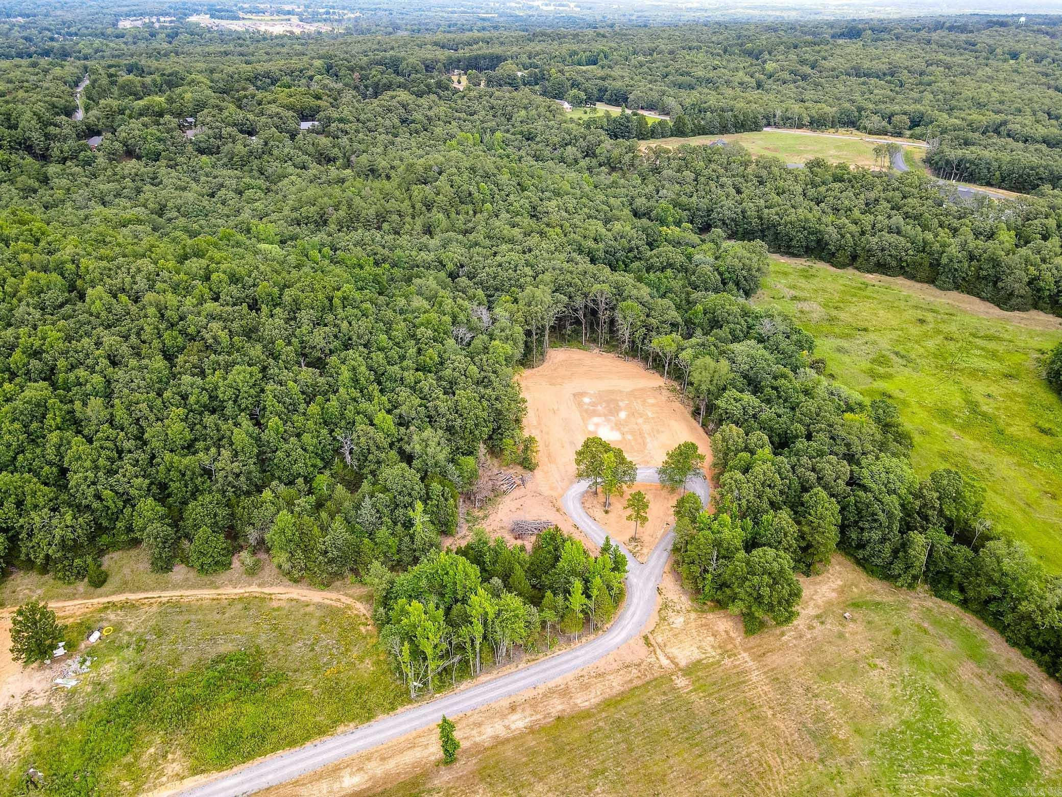 Gorgeous land to build your next dream home. Beautiful views. Land has been partially developed and has huge trees and several perfect building spots. Must see to appreciate all this property has to offer. Possible owner financing