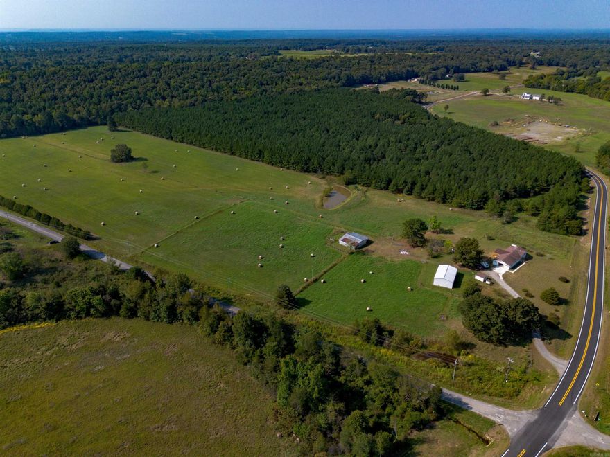 27-Acre Turnkey Farm with Home, Barns, and Pond.  This 27-acre property offers excellent accessibility, located less than a mile from Hwy. 5, with paved road frontage on both sides. Just 11 miles from Hwy. 64 at El Paso and 37 miles from both Conway and North Little Rock.  The 3-bedroom, 2-bath home has been completely remodeled with a modern floor plan, updated interior, fresh paint, new landscaping, and a back deck—ready to move in.   Supporting farm operations are a large shop, barn with working pens, and storm shelter.  The fenced and cross-fenced pastures are ideal for cattle or horses, with two ponds providing fishing and scenic enjoyment. The property also features a hardwood hillside with southern vistas, a block of mature pines, and open pasture historically used for hay production.  Wildlife enthusiasts will enjoy whitetail deer, turkey, small game, and fishing opportunities throughout the property. With well-maintained structures, ample water, and excellent road access, this farm is move-in ready and ready for its next owner to enjoy.