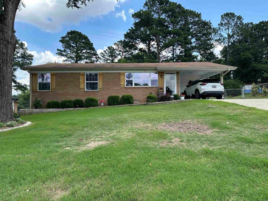 Hot Springs City Outside allows for a large lot with handy location in the center of town! Side road to CHI hospital, easily accessed from Werner Street, Higden Ferry Road or Central Ave. Ball Field across the street to enjoy the kids play. All quiet at night for stargazing. Full brick 1966 ranch with sharp upgrades to include open floor plan, newer kitchen, flooring, recessed lighting, tankless water heater & appliances. Covered back patio and the patio furniture stays. Large back yard offers privacy fencing and room for kids or a garden with the garden shed already present. Out buildings cost a fortune! Carport plus an extra parking pad. The best neighbors one could want is a plus. Bypass access is handy for any commuter. If you are downsizing or starting out this efficient home offers all you need and move in ready.
