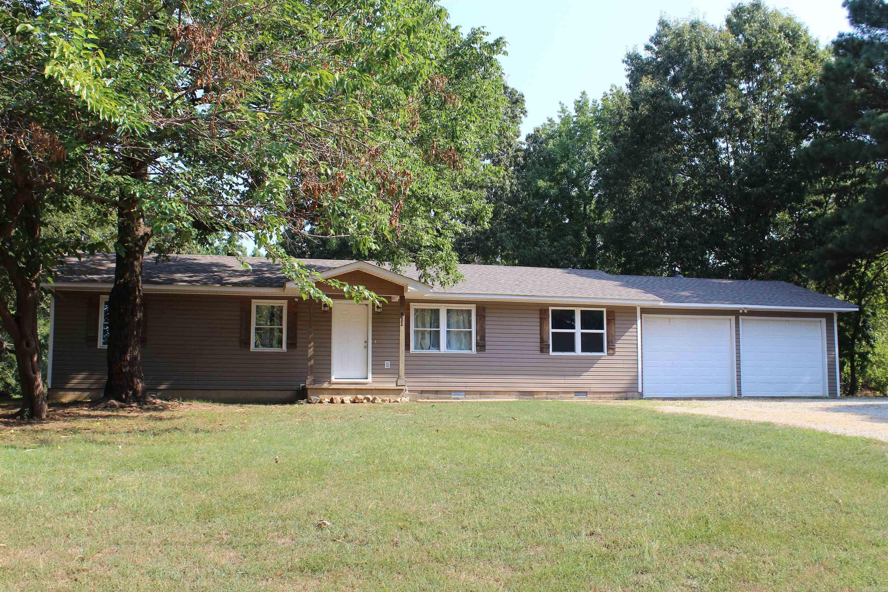Discover a little piece of country living right in the city. This spacious 5-bedroom, 2-bath home with a 2-car garage is tucked away in a quiet neighborhood while still being just minutes from schools, shopping, and dining. The home features an open-concept kitchen and living area, perfect for gatherings, along with a back deck overlooking the large .84-acre lot. Additional features include a concrete pad with power supply for a camper, making it ideal for those who love to travel or need extra parking. With plenty of space inside and out, this property offers the perfect balance of comfort and convenience. Key Features: 5 Bedrooms, 2 Baths 2-Car Garage Open Kitchen & Living Area Back Deck for Outdoor Enjoyment .84 Acre Lot Camper Power Hookup & Concrete Pad Quiet Neighborhood, Minutes from Town