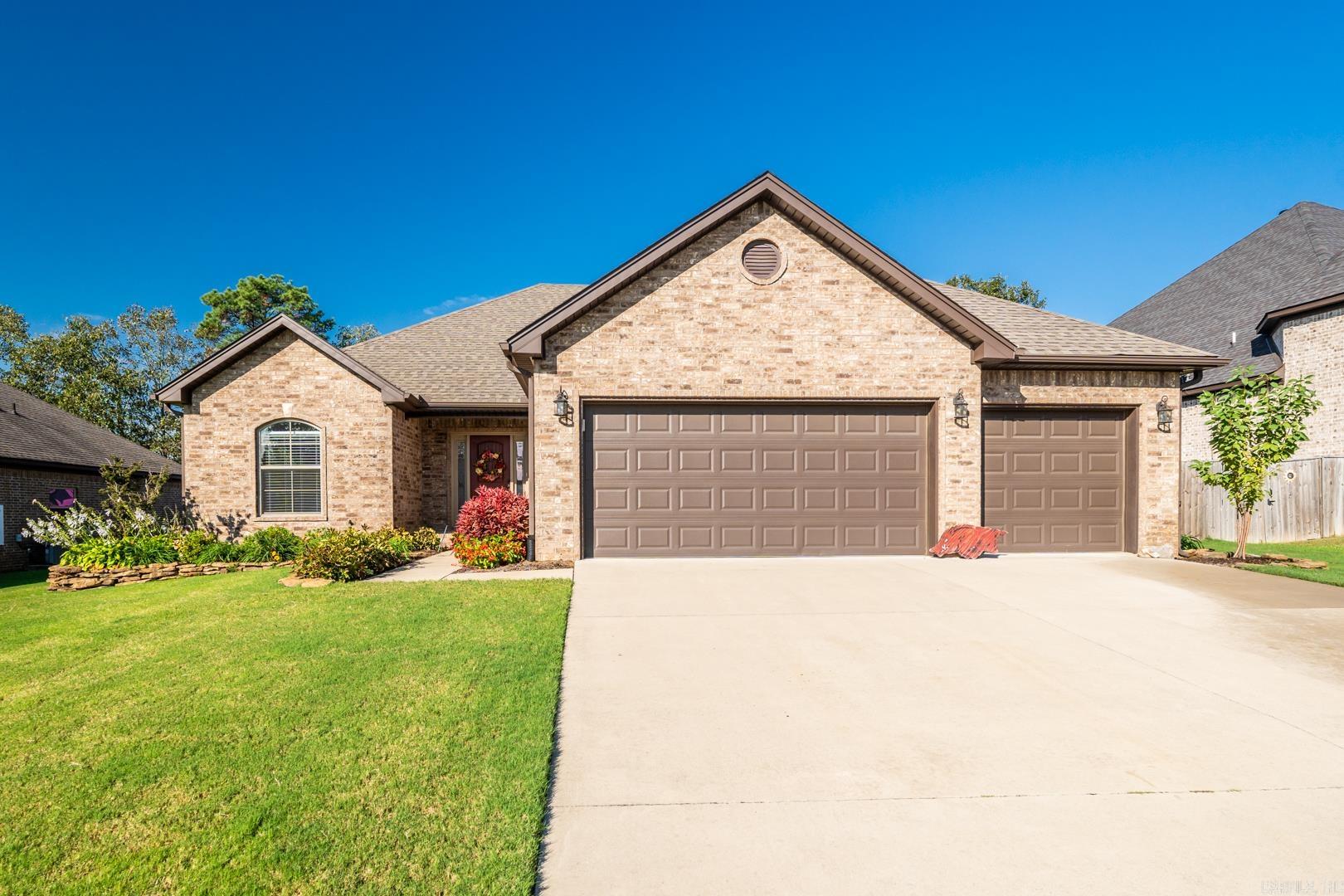 This practically new, stunning open floor plan home is nestled on a quiet cul-de-sac and offers a blend of luxury and functionality. The inviting entrance leads to a separate guest bedroom/office/flex space, a separate two-bedroom suite with a shared bath, and a private master suite featuring a fabulous master bath and a huge walk-in closet with direct access to the laundry room. The home also includes an office nook with built-ins, and the spacious living, dining, and kitchen area boasts stainless steel appliances, a gas stove, granite countertops, a stylish backsplash, and custom trim. The plank-style tile flooring flows throughout the home. Outside, enjoy a large covered and uncovered patio, a cozy front porch, and a professionally landscaped yard with a sprinkler system. The huge fenced backyard features a walkthrough gate on one side and a double gate on the other. Additional highlights include a three-car garage and plenty of outdoor space for relaxation or entertaining.