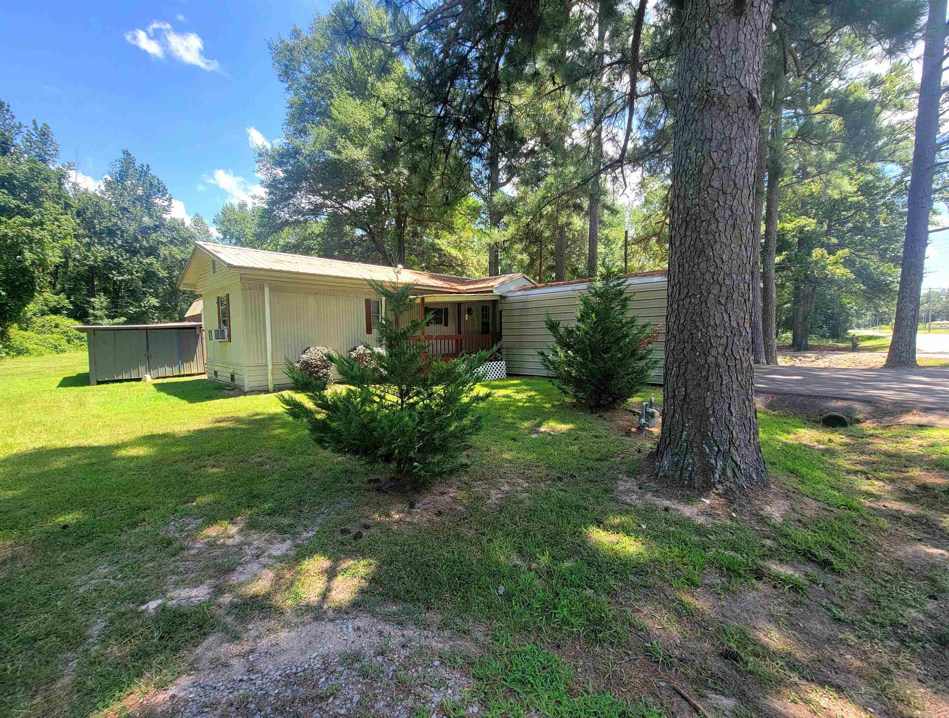 Charming and move-in ready, this well-maintained mobile home sits on a full acre of land, offering both space and comfort in a peaceful setting. The home features a double carport for convenient covered parking, along with a spacious back deck that's perfect for entertaining or enjoying quiet evenings outdoors. A large front porch stretches the full length of the home, creating a welcoming space to relax and unwind. Inside, you'll find a functional layout with plenty of room to personalize. The surrounding property offers endless potentialāwhether you're looking to garden, create a play area, or simply enjoy the open space. This home also comes with a recent appraisal and the last inspection on file, giving buyers peace of mind and a head start toward financing. Located in a quiet area while still offering convenient access to nearby amenities, this property is ideal for first-time buyers, downsizers, or anyone looking for affordable country living with room to grow. Donāt miss the opportunity to make this home yoursāschedule your showing today.