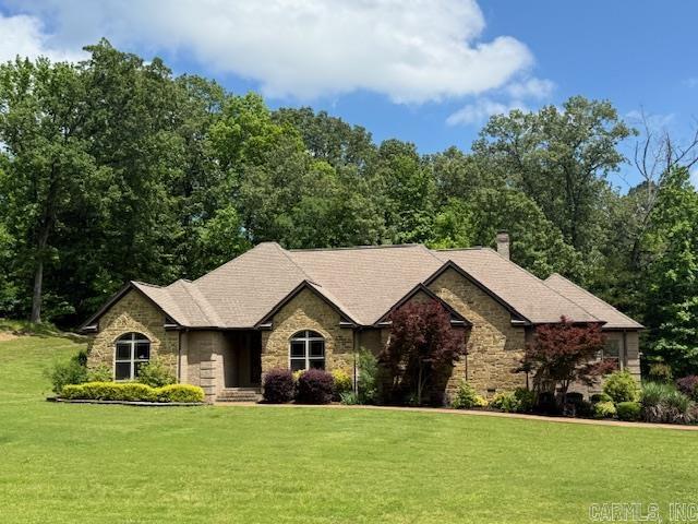 FIRST IMPRESSIONS ARE IMPORTANT! Entertain in UNCROWDED COMFORT in this 4-bedroom, 3-bathroom home in the beautiful Wolford Country Estates! The great room, dining room, kitchen and spacious family room are all centrally located. The SPACIOUS family room features a gas log fireplace, engineered hardwood flooring and a wood plank vaulted ceiling. AT YOUR SERVICE! Kitchen highlights include custom cabinets, granite counters and stainless appliances. PRIMARY BEDROOM with in-suite bath offers a suite retreat! Split floorplan has 2 bedrooms and guest bath on one end and an additional 2 bedrooms and 2 baths on the opposite end. Nicely situated on 1.64 ACRES with mature landscaping, enjoy summer evenings on your covered patio. Brick exterior, custom built with a 3-car garage, LOOK NO FURTHER!