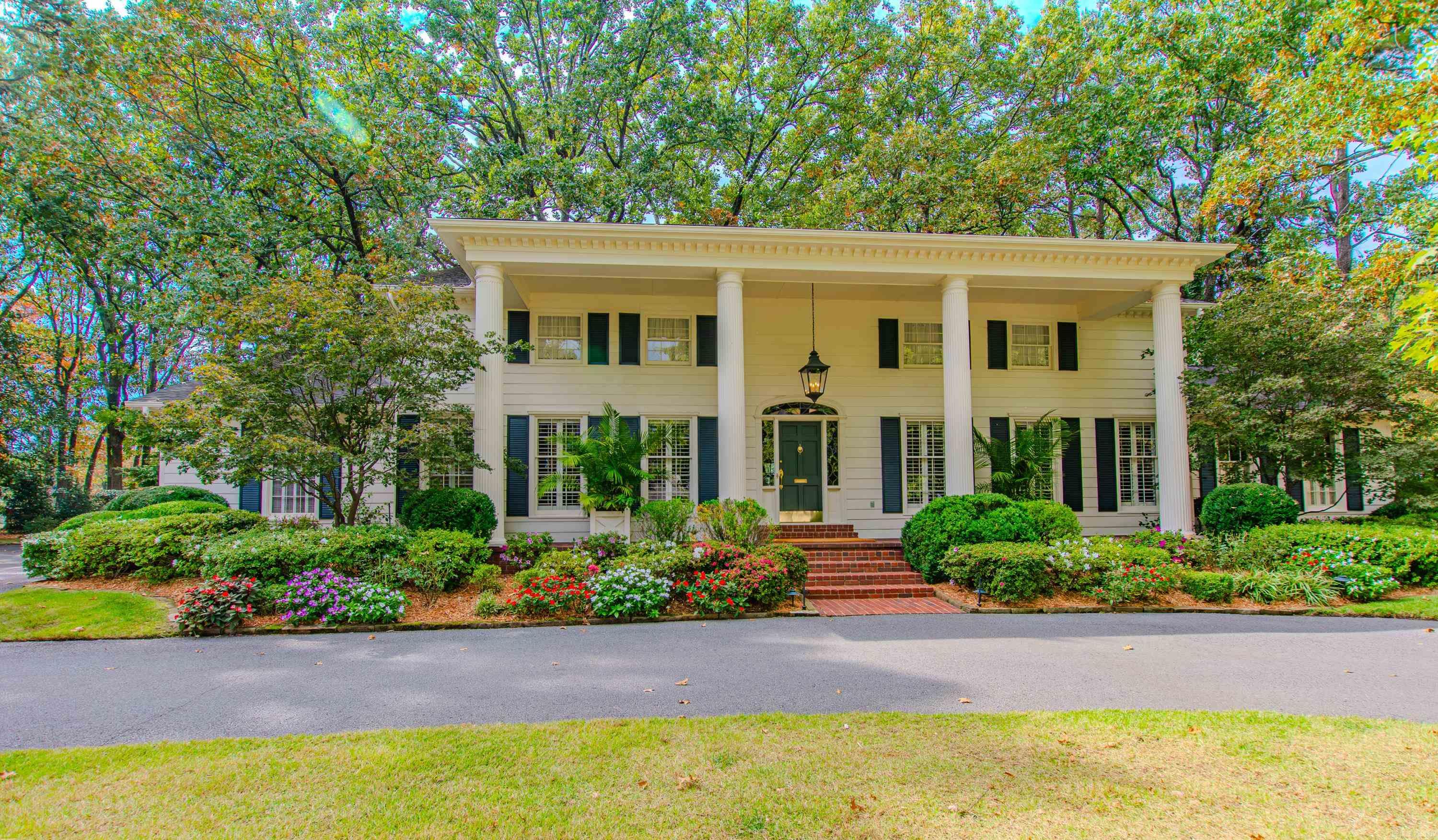 CLASSIC STYLE and SOUTHERN CHARM are evident. In this Pleasant Valley Home situated on oversize .70 Golf course lot. 1st Floor features: Circular driveway leads to massive 2 story column brick paved porch. Marble floor entry foyer opens to both living room w/decorative FP and formal dining w/blt-in China Cabinet. Updated kitchen w/bay windows eating area, SS appliances, hard surface counters, wood floors leads to office/laundry area & 1/2 bath. Separate family room w/beamed ceilings, site blt FP & wood floors, 2 BR off back hallway have updated connecting bath w/jetted tub. 2nd Floor Features: 14X19 Guest BR has knee space dressing area & updated bath 14x21 master suite has remodeled bath w/2 sink vanity, separate glass shower, and step up columned area w/jetted tub. Hallway leads to 6x50 finished out storage room. Other Note Worthy Features: Rear columned partially covered brick patio. Custom water feature/fountain and view of Gold Course. 9' Ceilings on 1st Floor.